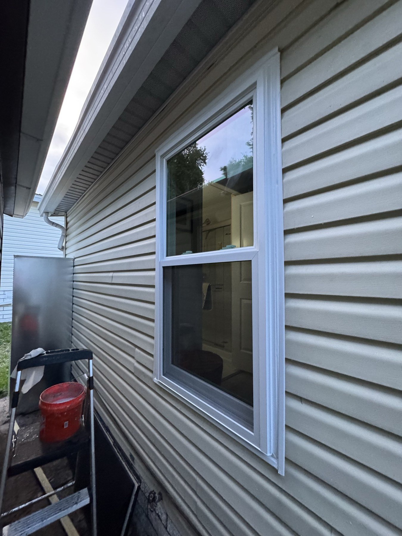 Professional technician installing impact window