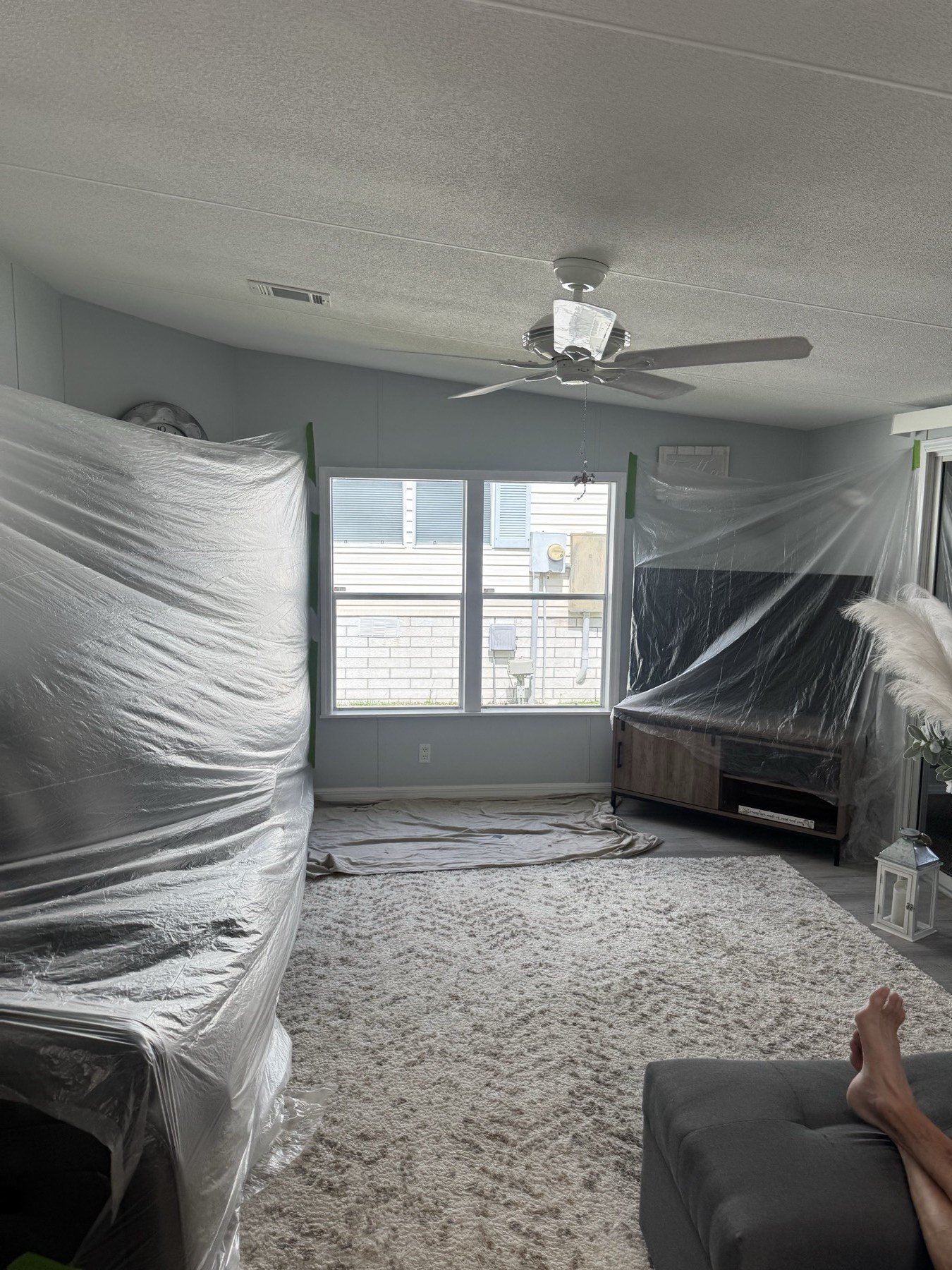 Bedroom fully covered in plastic before work begins